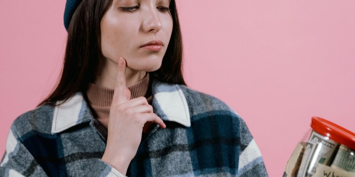 A person deeply contemplating an important financial decision related to real estate investment.