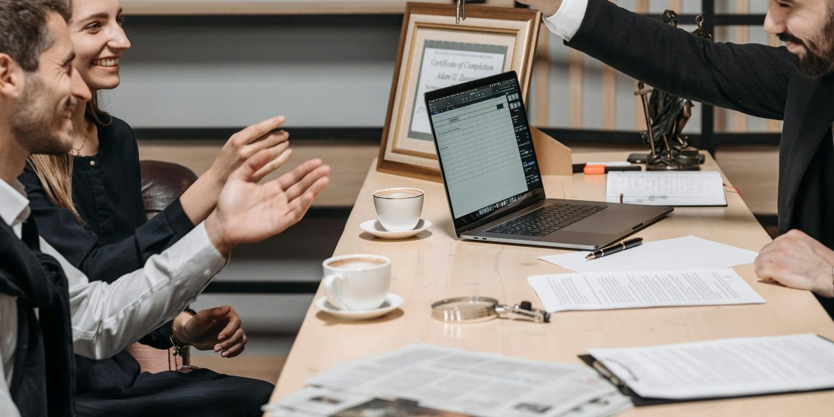 A professional real estate agent explains comprehensive services to a client, beyond just property viewings.