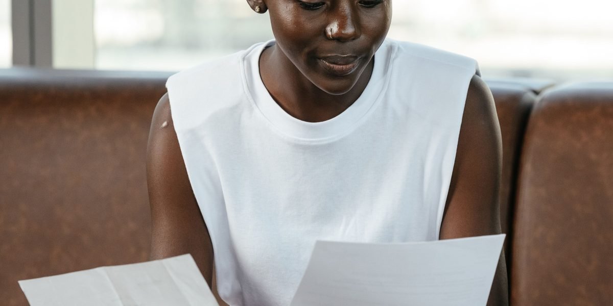 A professional carefully examines a contract, highlighting the importance of due diligence in property dealings.
