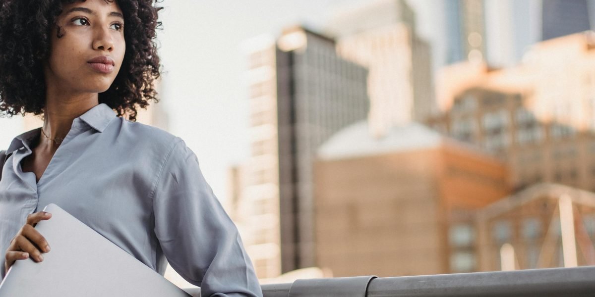 A person deep in thought, representing the careful consideration of common risk factors in real estate investment.
