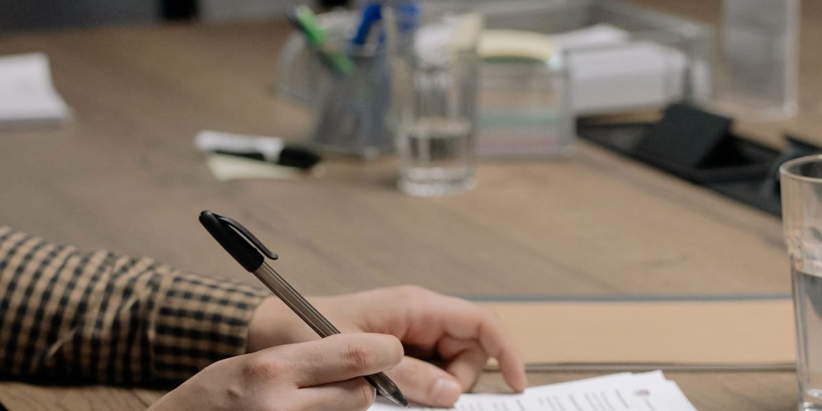 A client carefully reviews documents with a real estate agent to ensure clarity and trustworthiness.