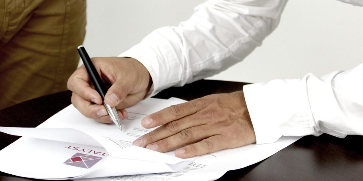 An investor diligently reviewing legal documents, emphasizing the importance of understanding regulations.